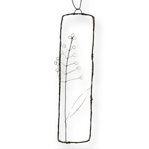 Handmade wire picture with a fennel sprig