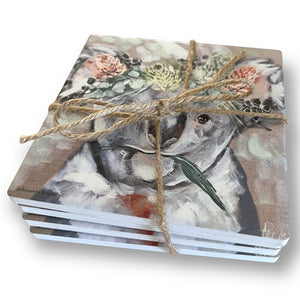 Set of four coasters with koala image and tied together with jute