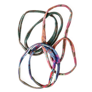 Three different coloured fabric hair bands to tie up your hair