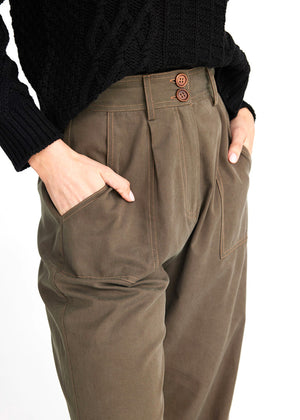 Close up view of the front of the Artemis pants with front pockets and pleats