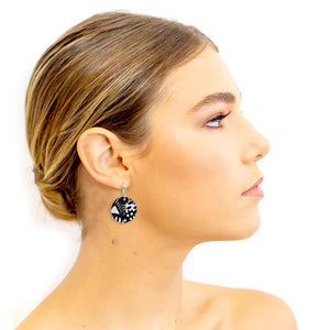 Model wearing Small Art Disc earrings with Nights of Eden design by Australian artist from Riley Burnett Australia