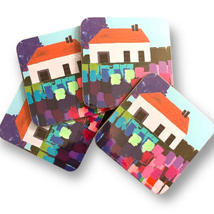 Set of 4 coasters with image of cottage and colourful flowers by Anna Blatman