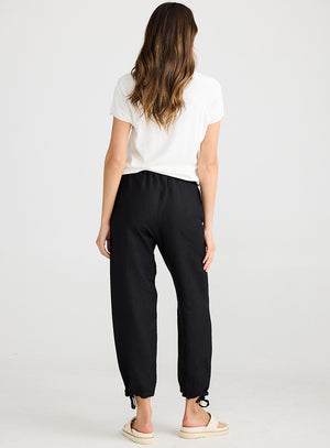 Rear view of Relaxed fit black pants with drawstring leg cuff from Shanty