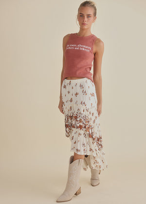 Ruffled long skirt, white with gentle floral design in rust tones