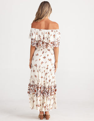 Rear view of Road Trip top teamed up with Ruffled long skirt, white with gentle floral design in rust tones