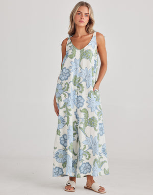 This Temple jumpsuit is white with large blue flowers and green leaves