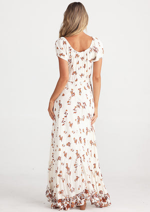 Rear view of Beautiful full length dress in white with flower prints from Australian designer label Talisman