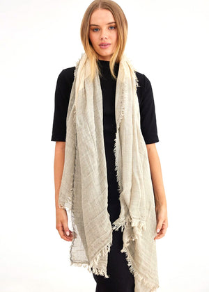 Model wearing the Yana scarf by Holiday in ivory colour