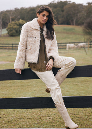 Model warm and cozy in Talisman's Cyrus Jacket in beige