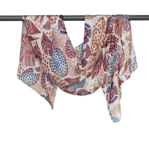 This Justine Flower Print scarf has shades of copper and cranberry with a touch of sky blues which makes this silk scarf from DLUX a winner