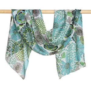 The Justine Flower Print scarf is light weight and stunning with its summer tones of blues and greens