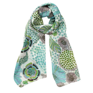 The Justine Flower print scarf has a modern flower design in soft summer tones of blue and green can be worn all year round