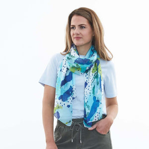 Our silk scarves are so beautiful against the skin and you won't be disappointed with our Sunday Spot scarf in shades of ocean blue from DLUX