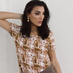 This Janis Tee has the Aztec design in white and earthy tones, and is made of bamboo fabric