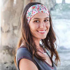 This Boho bandana from Natural Life is white with pretty flowers and leaves in pink, tan and teal