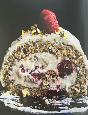 Delicious Pistachio roulade with raspberries and white chocolate is one of the fabulous dishes in Ottolenghi's book 'Sweet'