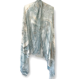 Stunning marble print covering the entire scarf in shades of blue and beige with tan flecks