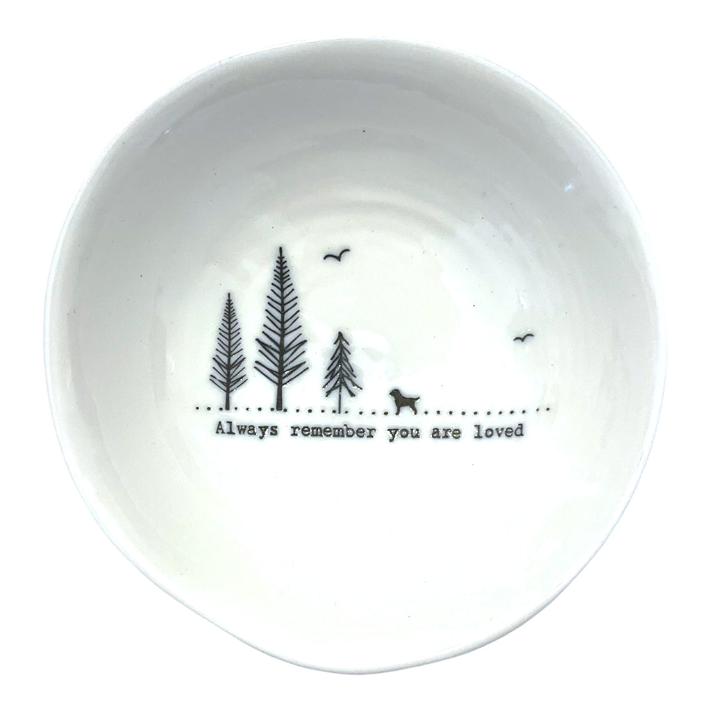 Small wobbly edged bowl with three pine trees, a dog and birds with the words &#39;Always remember you are loved&#39;