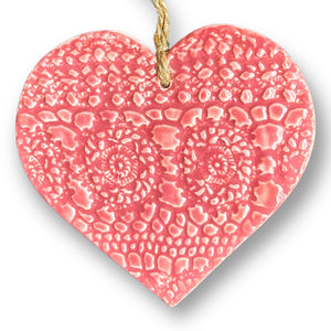 Hand made ceramic hanging heart in rose pink colour with unique 3D pattern by Australian sculptor Wendy Britton