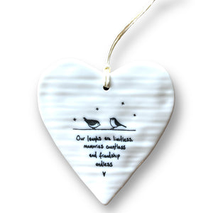 Porcelain hanging heart with two birds and the words 'Our laughs are limitless, memories countless and friendship endless'