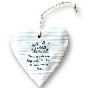 Wild flowers growing in a field with butterflies and the words 'There is only one happiness in life, to love and be loved' can be found on this porcelain hanging heart