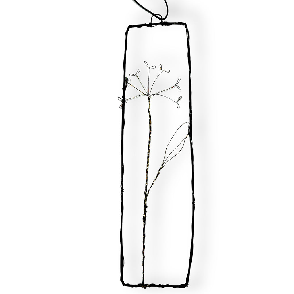 Handmade wire picture with sorrel sprig