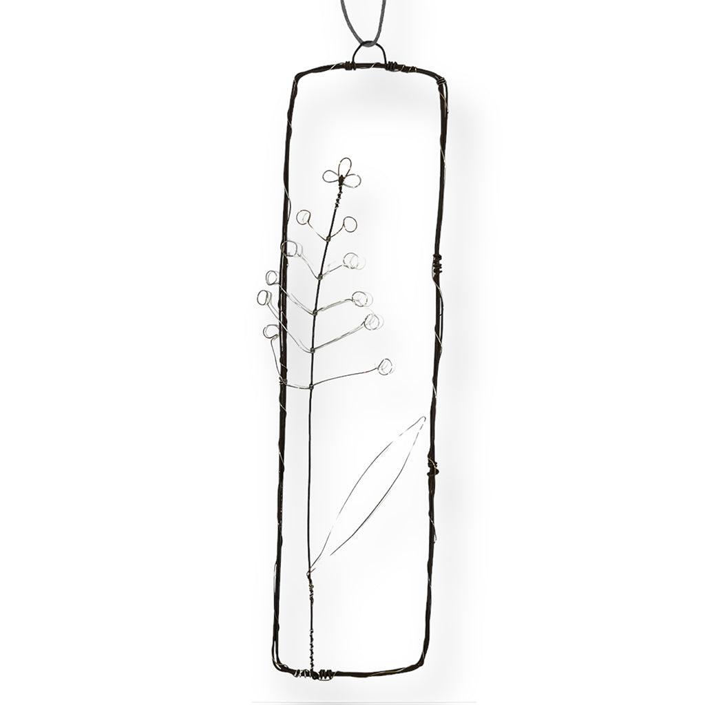 Handmade wire picture with a fennel sprig