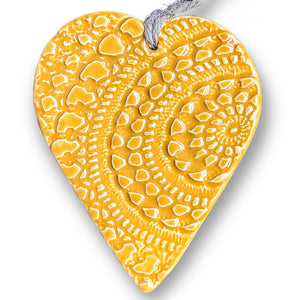 Hand made Ceramic hanging heart in sunflower yellow with unique 3D pattern