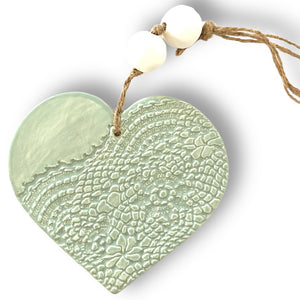 Hand made ceramic hanging heart in sage colour with unique 3D pattern by Australian sculptor Wendy Britton