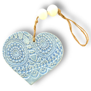 Hand made ceramic hanging heart in pale blue colour with unique 3D pattern by Australian sculptor Wendy Britton