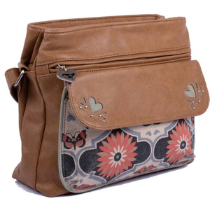 The Traveller bag from bsirius has a combination of butterfly mandala canvas print and vegan leather in a tan. colour