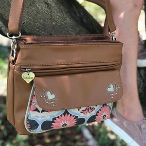 The Melbourne bag is vegan friendly with its tan coloured PU and canvas materials