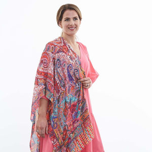 The Valli Paisley scarf has a stunning array of colours in pink, red and blue tones