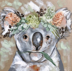 Coaster with am image painted by Amanda Brooks of a koala wearing a banksia and gum nut head piece